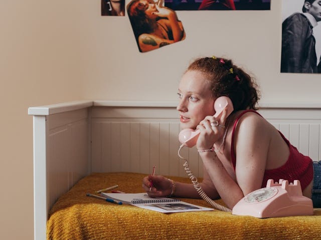 Woman using landline
